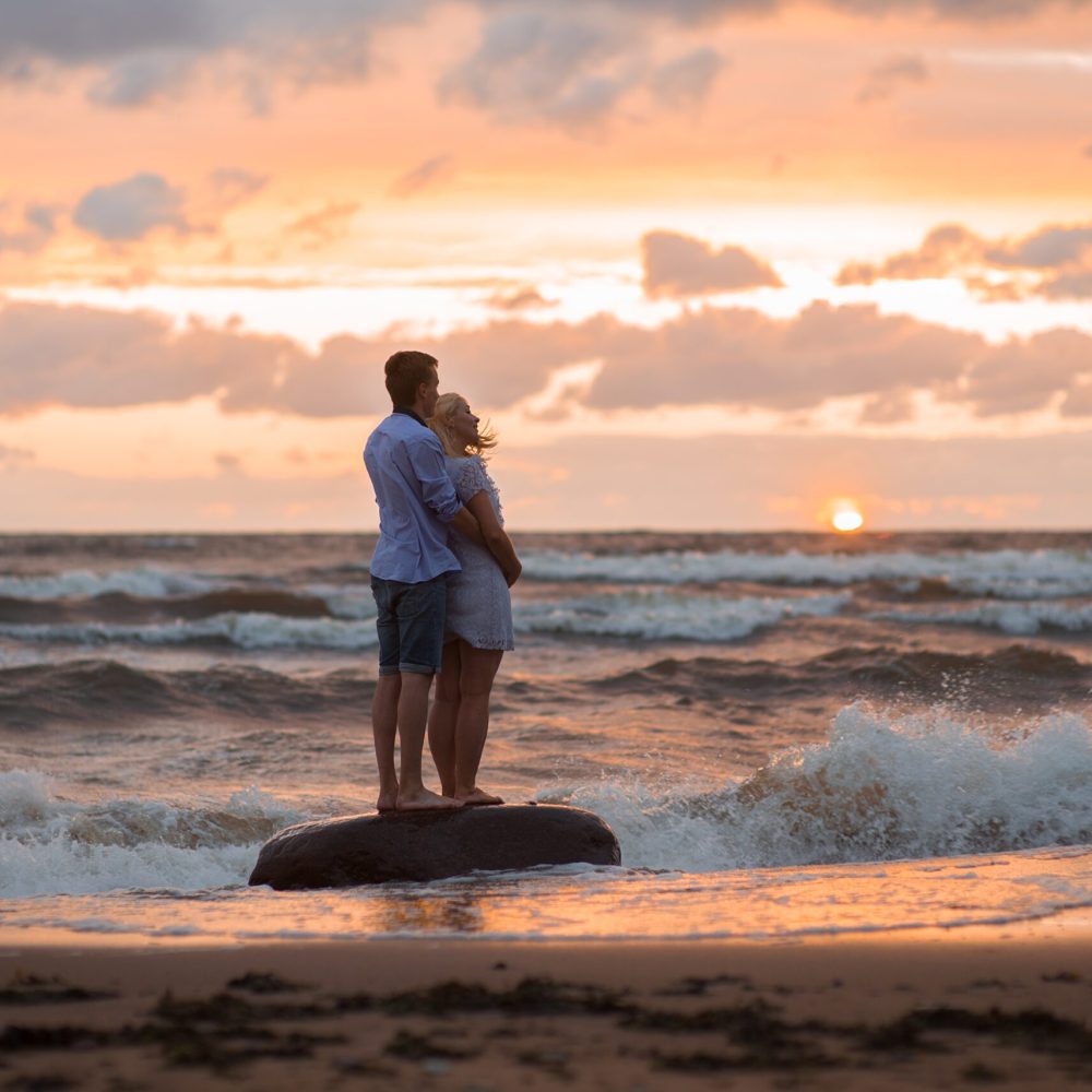 a-young-couple-watching-a-beautiful-sunset-nomina-2023-11-27-05-04-36-utc